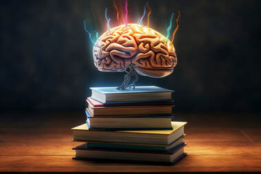 A stack of books with a human brain on top shooting colorful sparks - scientific research proves readers prefer solid story before polished prose.